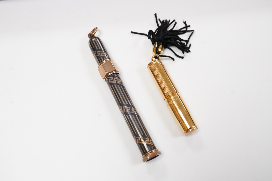 A collection of vintage pencils including an early enamel example